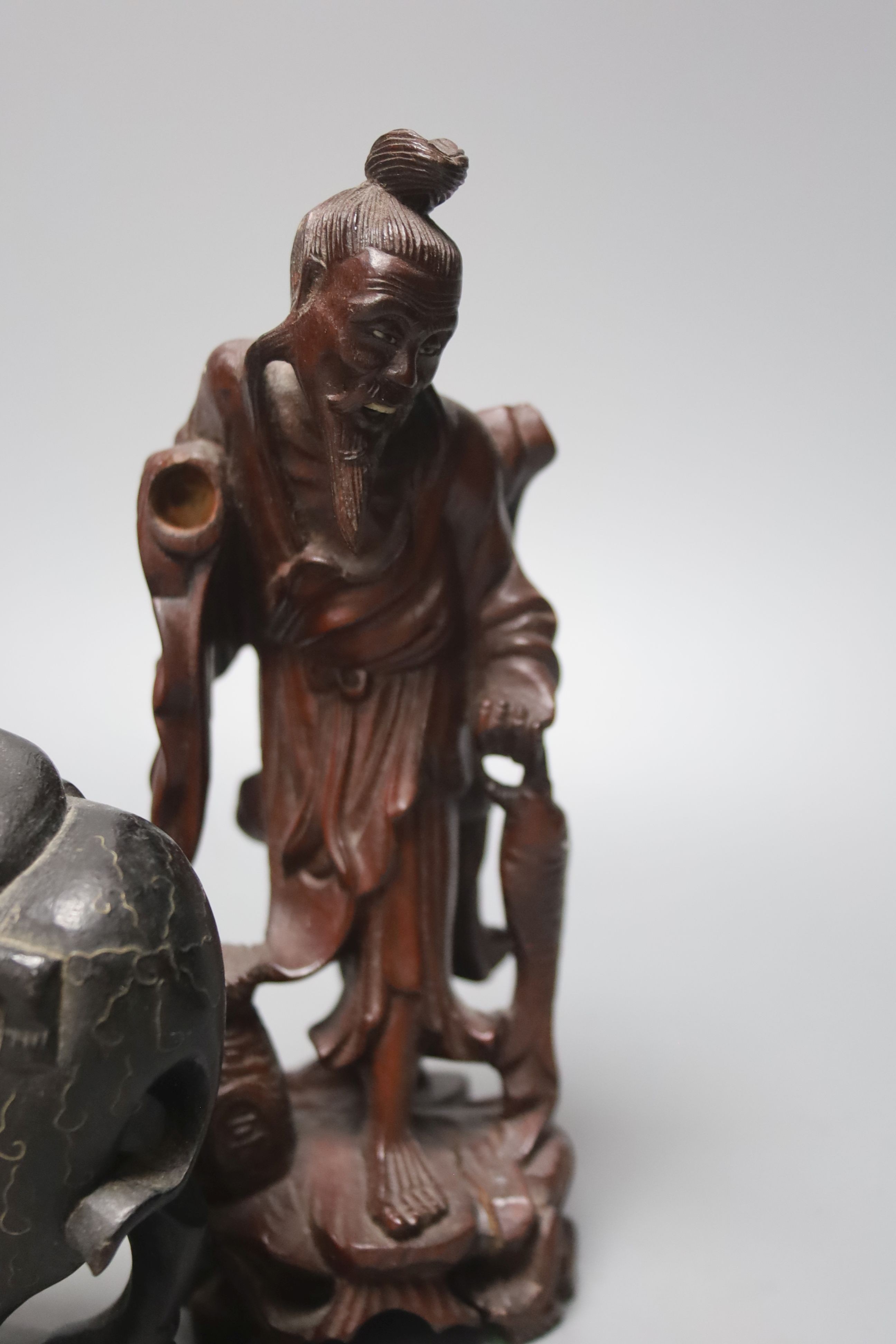 Four Chinese carved wood figures and a box, 18 cms high.